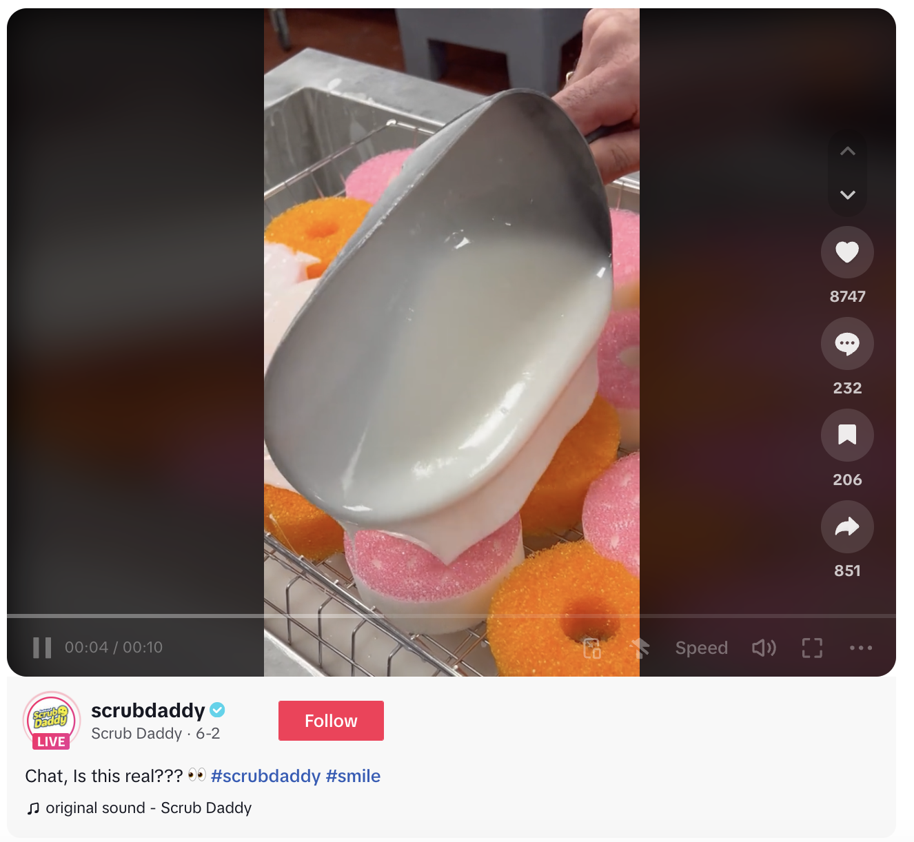 Scrub Daddy's TikTok video of someone glazing a tray of donut-shaped sponges.