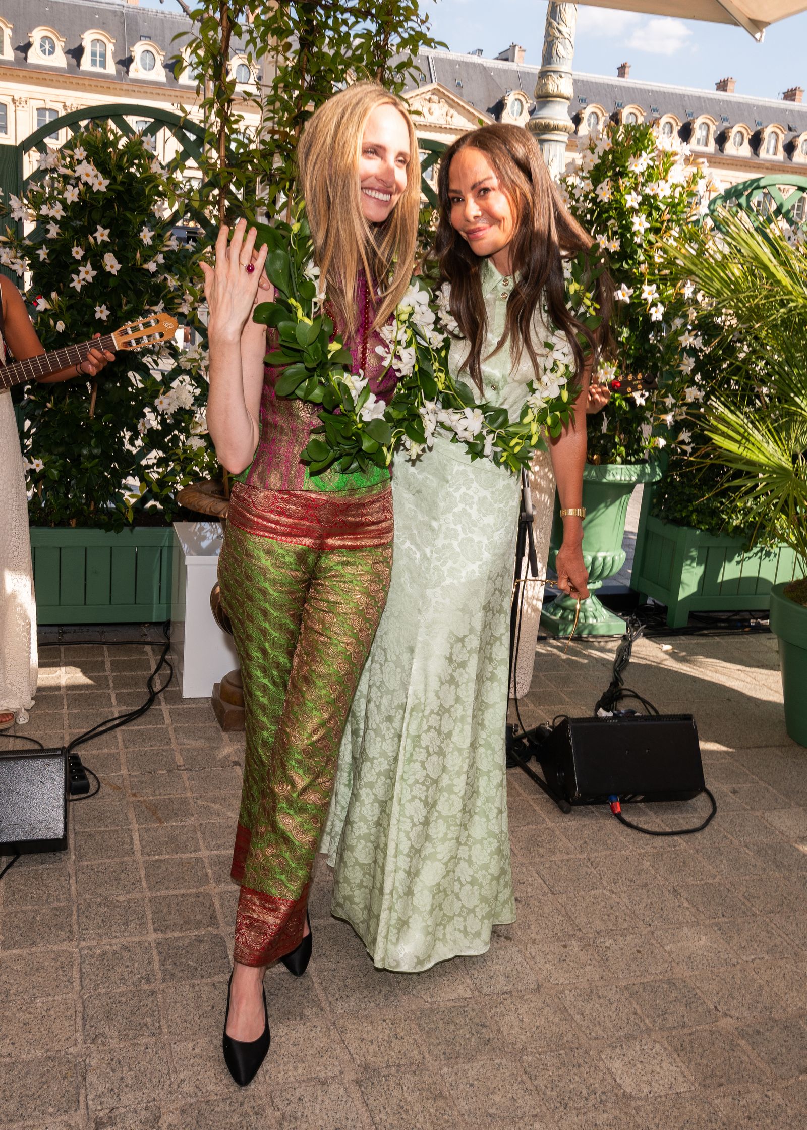 Image may contain Lauren Santo Domingo Plant Potted Plant Adult Person Wedding Electronics Speaker and Clothing
